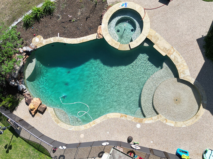 dirty swimming pool with hot tub