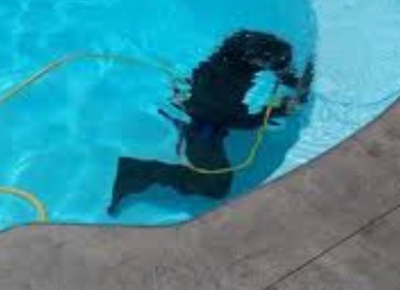 Emerald Pool Care under water for pool leak detection.