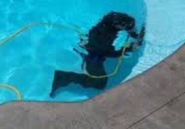 Emerald Pool Care under water for pool leak detection.